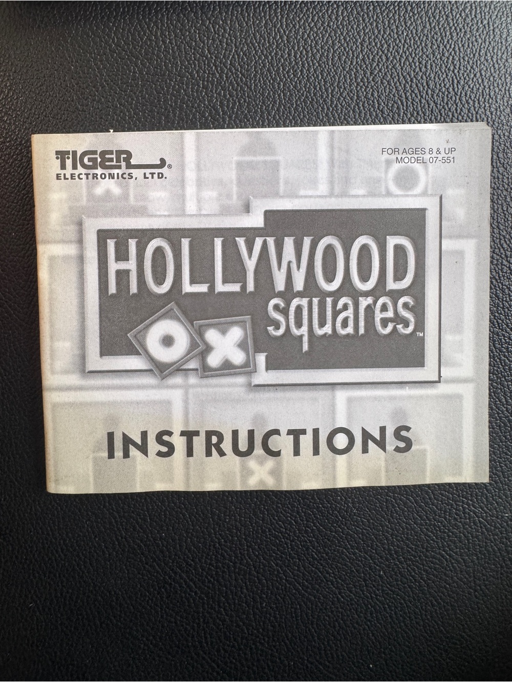 Instruction manual for 'Hollywood Squares' handheld electronic game by Tiger